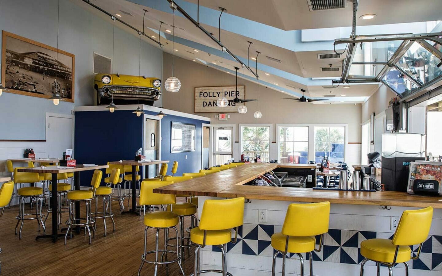old school retro restaurant with high chairs around a large square bar