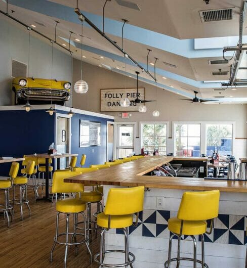 old school retro restaurant with high chairs around a large square bar