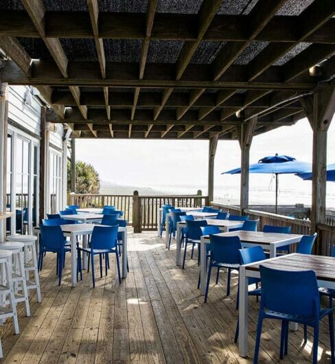 Outdoor dining area with bar and umbrellas