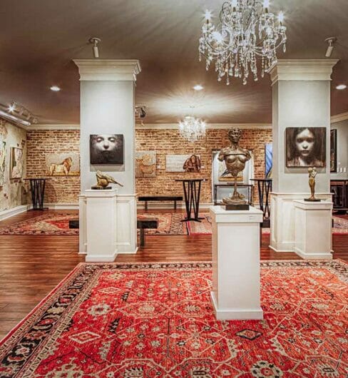 glamorus art covered event space with large floor rugs