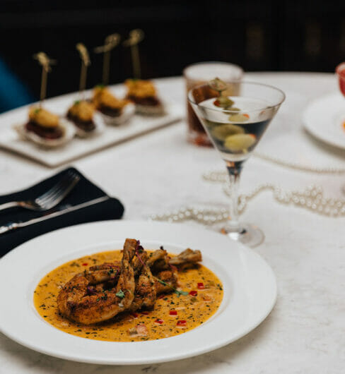 two plated dinners with two classic cocktails
